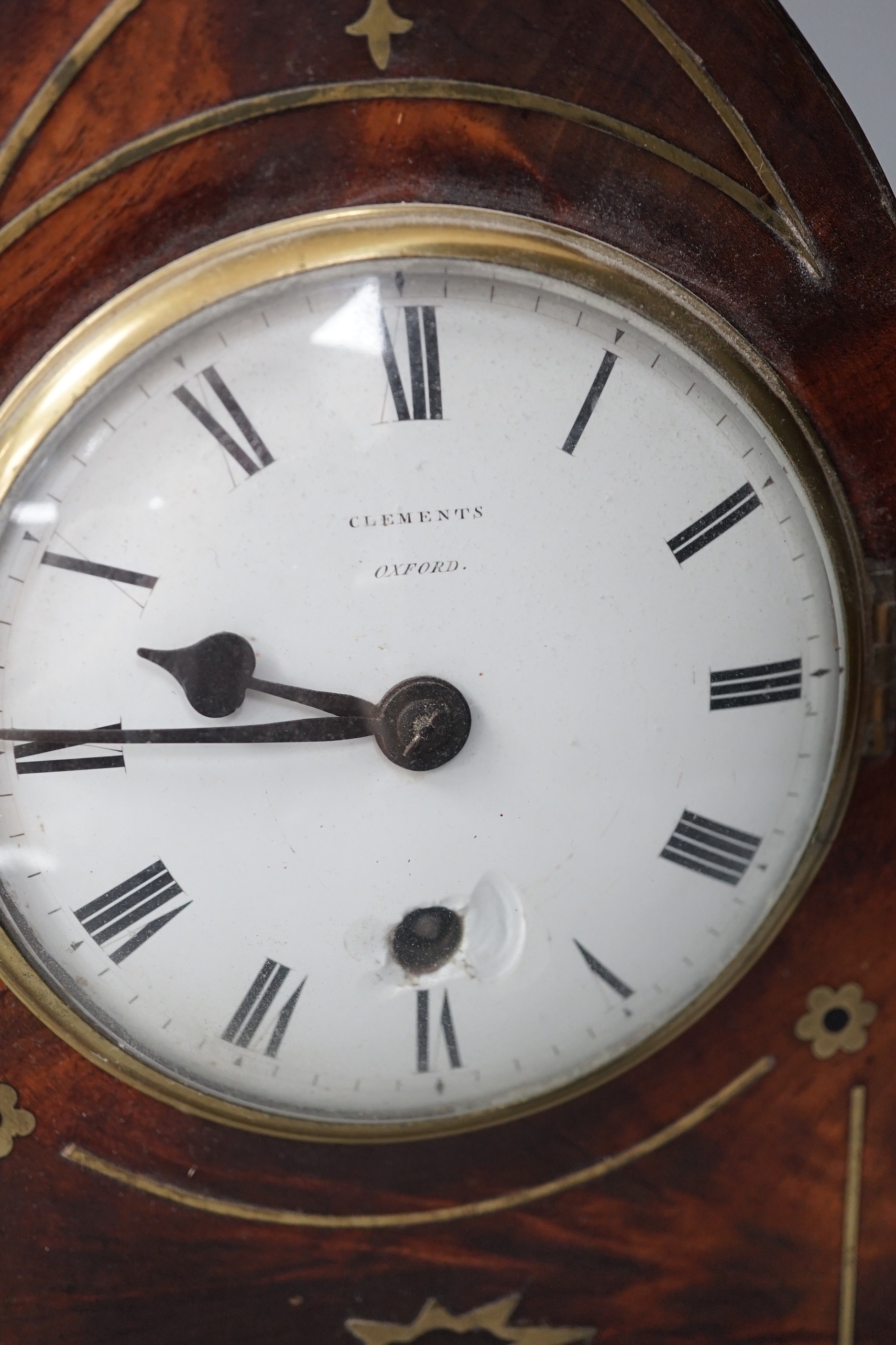 A Clements of Oxford brass inset mahogany lancet timepiece, with pendulum. 30cm high